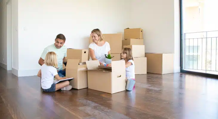 Family opening up moving boxes